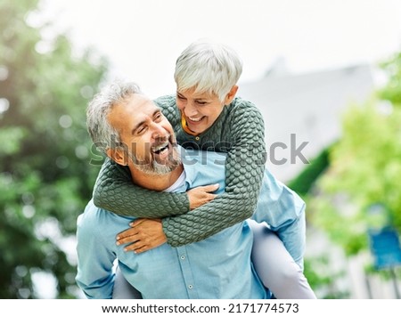 Happy active senior couple outdoors Royalty-Free Stock Photo #2171774573
