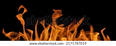 orange flame isolated on black background Royalty-Free Stock Photo #2171787019