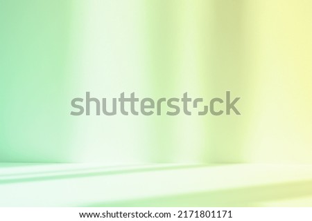 Abstract green studio background for product presentation. Empty room with shadows of window. Display product with blurred backdrop. Royalty-Free Stock Photo #2171801171