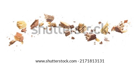 Flow of broken wafers into pieces on a white background Royalty-Free Stock Photo #2171813131