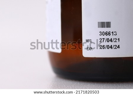 Selective focus on manufacturing date and expiry date indicator aka mfg and exp dates in the bottle product label  Royalty-Free Stock Photo #2171820503