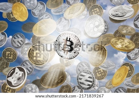 Falling cryptocurrencies (bitcoins, dogecoins, shiba coins, binance coins and other) over blue sky. Cryptocurrency concept.