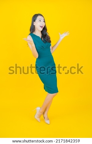 Portrait beautiful young asian woman smile with action on color background