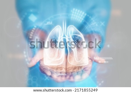 Medical concept, doctor's hands in a blue coat close-up. lung ultrasound, x-ray, hologram. Medical care, anatomy, doctor's appointment, coronavirus, treatment. mixed media Royalty-Free Stock Photo #2171855249