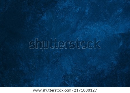 Dark blue colored abstract textured background. Decorative plaster on the wall.