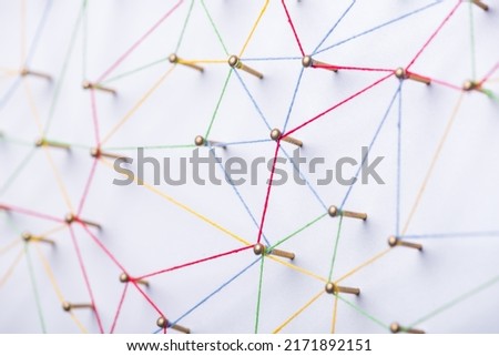 abstract web line connection of color yarn from nail node to node on white background , networking concept Royalty-Free Stock Photo #2171892151