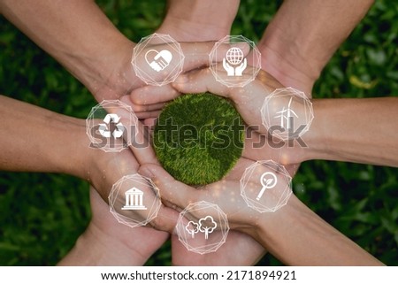 ESG concept of environmental, social and governance.Group of people holding green earth with ESG icon. Royalty-Free Stock Photo #2171894921