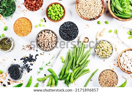 Beans, legumes and green sprouts. Dried, raw and fresh, top view. Red beans, lentils, chickpeas, soybeans. Healthy, nutritious, diet food, vegan protein, micronutrients and fiber sources Royalty-Free Stock Photo #2171896857