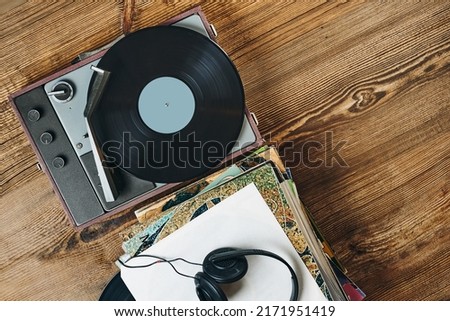 Listening to music from vinyl record. Playing music from analog disk on turntable player. Enjoying music from old collection. Relaxing at home. Retro and vintage. Audio stereo equipment. Analog sound