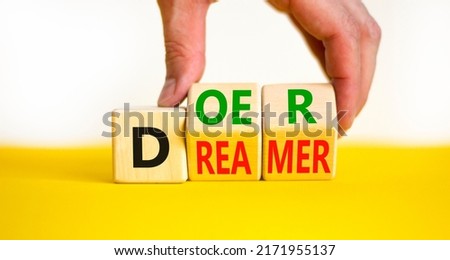 Doer or dreamer symbol. Concept words Doer or dreamer on wooden cubes. Businessman hand. Beautiful yellow table white background. Business and doer or dreamer concept. Copy space. Royalty-Free Stock Photo #2171955137