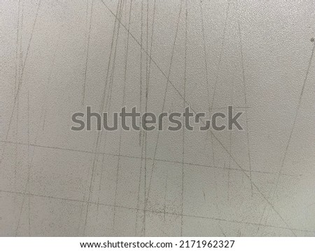 Scratches on a white table. Soft tones. Used for background images and abstract illustrations