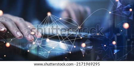 Data exchanges, business technology and digital marketing, futuristic technology background, internet network concept. Business man working on digital tablet and laptop computer, data linked Royalty-Free Stock Photo #2171969295