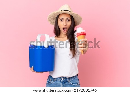 pretty hispanic woman with a portable freezer and an ice cream