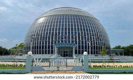 Solar Dome planetarium and auditorium with full of solar panel on outside wall, Go Green technology, Solar cell energy conceptual background Royalty-Free Stock Photo #2172002779