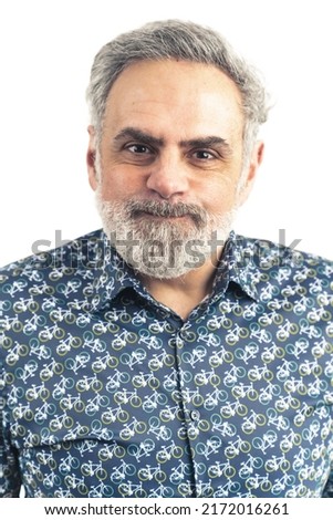 mature grey haired man in patterned shirt making silly expression portrait white background . High quality photo