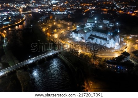 Aerial view of Galway cathedral at night. With some motion blurred on car crossing the bridge.