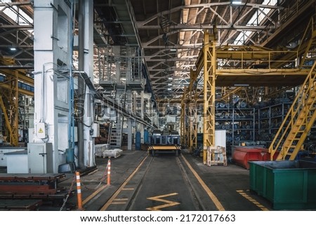 Interior of big industrial factory inside. Metalworking plant, heavy industry