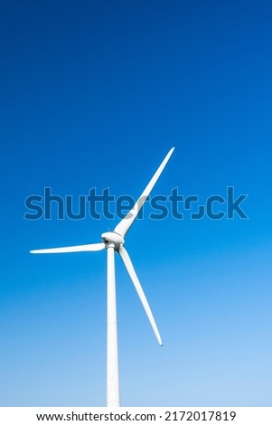 Close-up of windmills group with blue sky on the west coast of Taiwan.