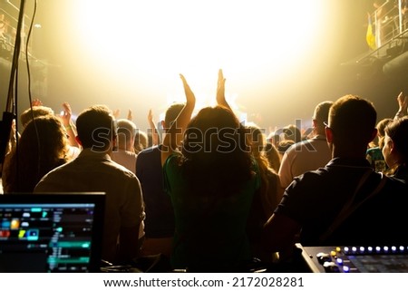 The audience applauded by the stage artist. They shines the spotlight. Royalty-Free Stock Photo #2172028281
