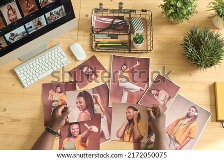 Photo editor choosing photos for content