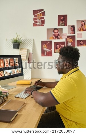 Editor retouching professional photo using computer