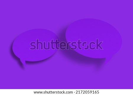Purple paper in the shape of speech bubbles against a purple background. Communication bubbles.Design