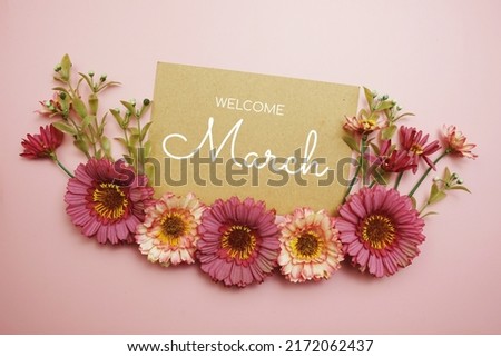 Welcome March typography text with flowers on pink background