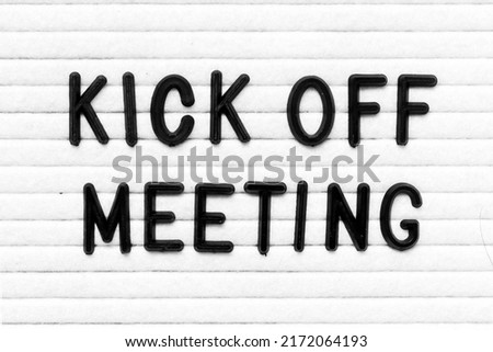 Black color letter in word kick off meeting on white felt board background Royalty-Free Stock Photo #2172064193