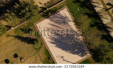 Two friends playing basketball, Cordoba in Argentina. Aerial top-down view