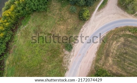 Drone image. aerial view of rural area with fields, trees, paths and roads. High quality photo