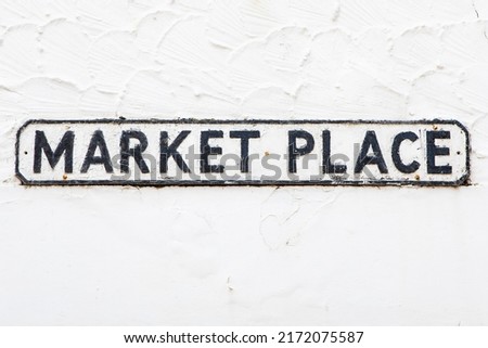 A street sign for Market Place in the seaside town of Whitby in North Yorkshire, UK.