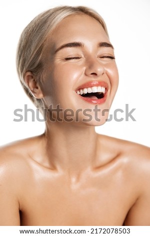 Dental care and beauty. Vertical of laughing happy woman with perfect white teeth, natural smile, glowing healthy facial skin, standing over white background Royalty-Free Stock Photo #2172078503