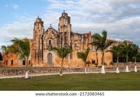 Exterior view of the historical Church and Convent of San Miguel Arcangel in Maní, in the central region of the Yucatan Peninsula, in the Mexican state of Yucatán, Mexico. It was built in 1549. Royalty-Free Stock Photo #2172083465