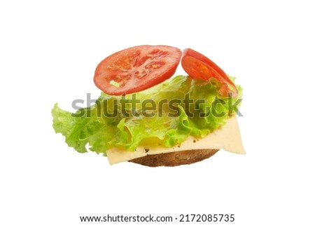 Flying deconstructed sandwich made from slices of bread, tomatoes, cheese on a white background. Levitation of a simple sandwich. Isolated. Royalty-Free Stock Photo #2172085735