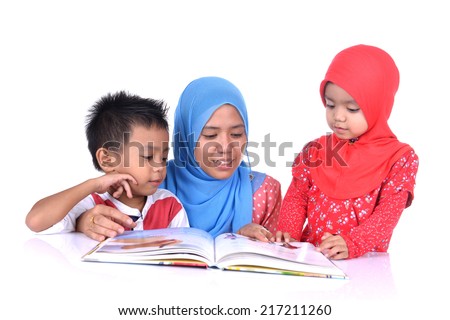 A Muslim Mother teaching his little children reading with white background. Family Education concept. Royalty-Free Stock Photo #217211260