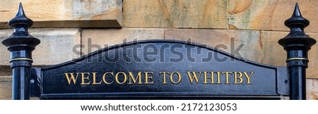 Weclome to Whitby sign in the seaside town of Whitby in North Yorkshire, UK.