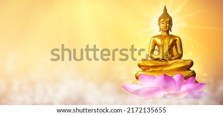 Buddha statue water lotus Buddha standing on lotus flower on orange background Royalty-Free Stock Photo #2172135655