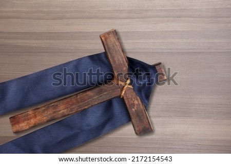 Christian cross leaning on desk in the background. Easter religion faith concept