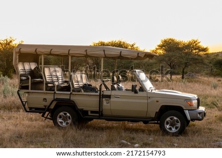 Safari car in sunset in Namibia Africa Royalty-Free Stock Photo #2172154793
