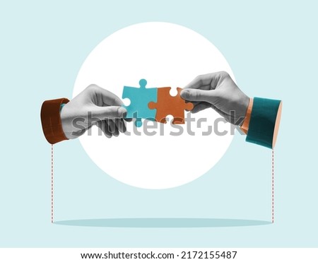 Hands combine puzzle pieces. Art collage. Royalty-Free Stock Photo #2172155487