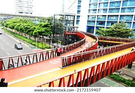 Defocused abstract background of beautiful pedestrian bridge. The design and color is very nice. Suitable for a place to relax, and take pictures. Located in the center of Jakarta, Indonesia.