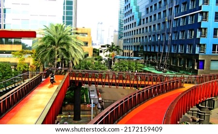 Defocused abstract background of beautiful pedestrian bridge. The design and color is very nice. Suitable for a place to relax, and take pictures. Located in the center of Jakarta, Indonesia.