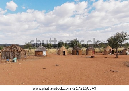 View of traditional huts at Himba village near Etosha National Park, Namibia, Africa Royalty-Free Stock Photo #2172160343
