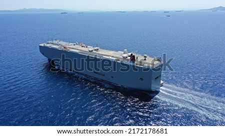 Aerial drone photo of Large RoRo (Roll on-off) car cargo ship cruising the Mediterranean deep blue sea