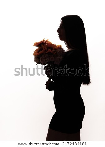 silhouette beautiful latina girl holding a bouquet of sunflowers, isolated on white background, mother's day gift concept.