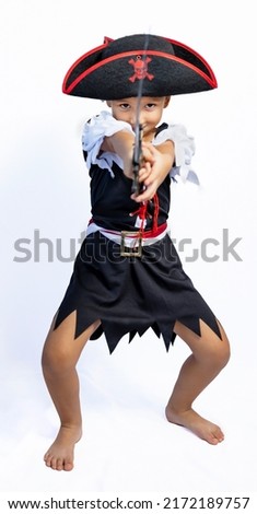 Studio portrait of little girl dressed in pirate costume