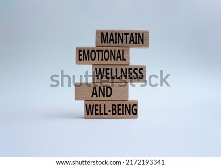 Maintain emotional Wellness and Well-being symbol. Wooden blocks with words Maintain emotional Wellness and Well-being. Beautiful white background. Business  concept. copy space Royalty-Free Stock Photo #2172193341