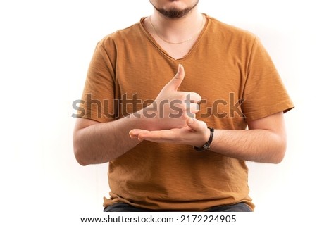 Man learns sign language to speak. Hand gestures of deaf people.