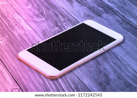 Abstract neon glowing lines. Smartphone blank screen. Mockup generic device.
