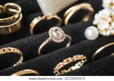 Gold jewelry diamond rings show in luxury retail store display showcase Royalty-Free Stock Photo #2172245571
